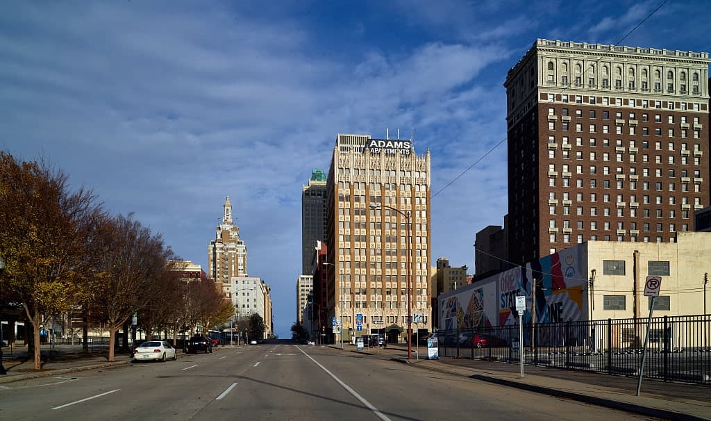 A view down West 4th Street through downtown Tulsa, Oklahoma, past the Adams Apartments tower